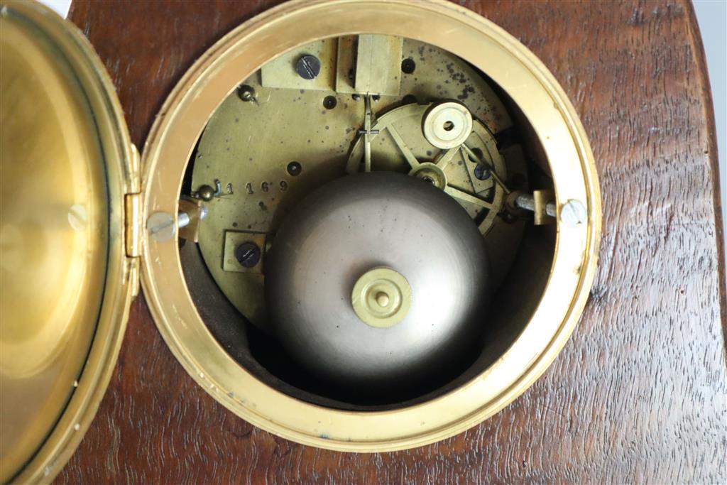 An unusual French Art Nouveau walnut mantel clock, width 9in. height 22.75in.